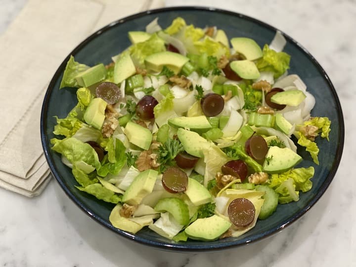 A bowl of Waldorf salad with grapes, walnuts and other superfoods, to complement a low-inflammation lifestyle.