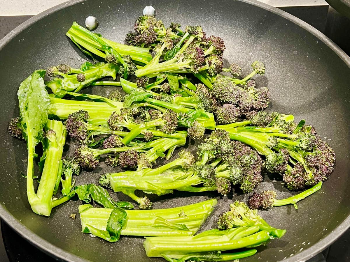frying pan with purple sprouting broccoli